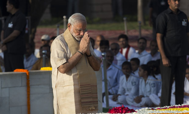 Prime Minister Narendra Modi pays tributes at the memorial of Mahatma Gandhi on the occasion of his birth anniversary, in New Delhi (Photo: AP) Prime Minister Narendra Modi pays tributes at the memorial of Mahatma Gandhi on the occasion of his birth anniversary, in New Delhi (Photo: AP)